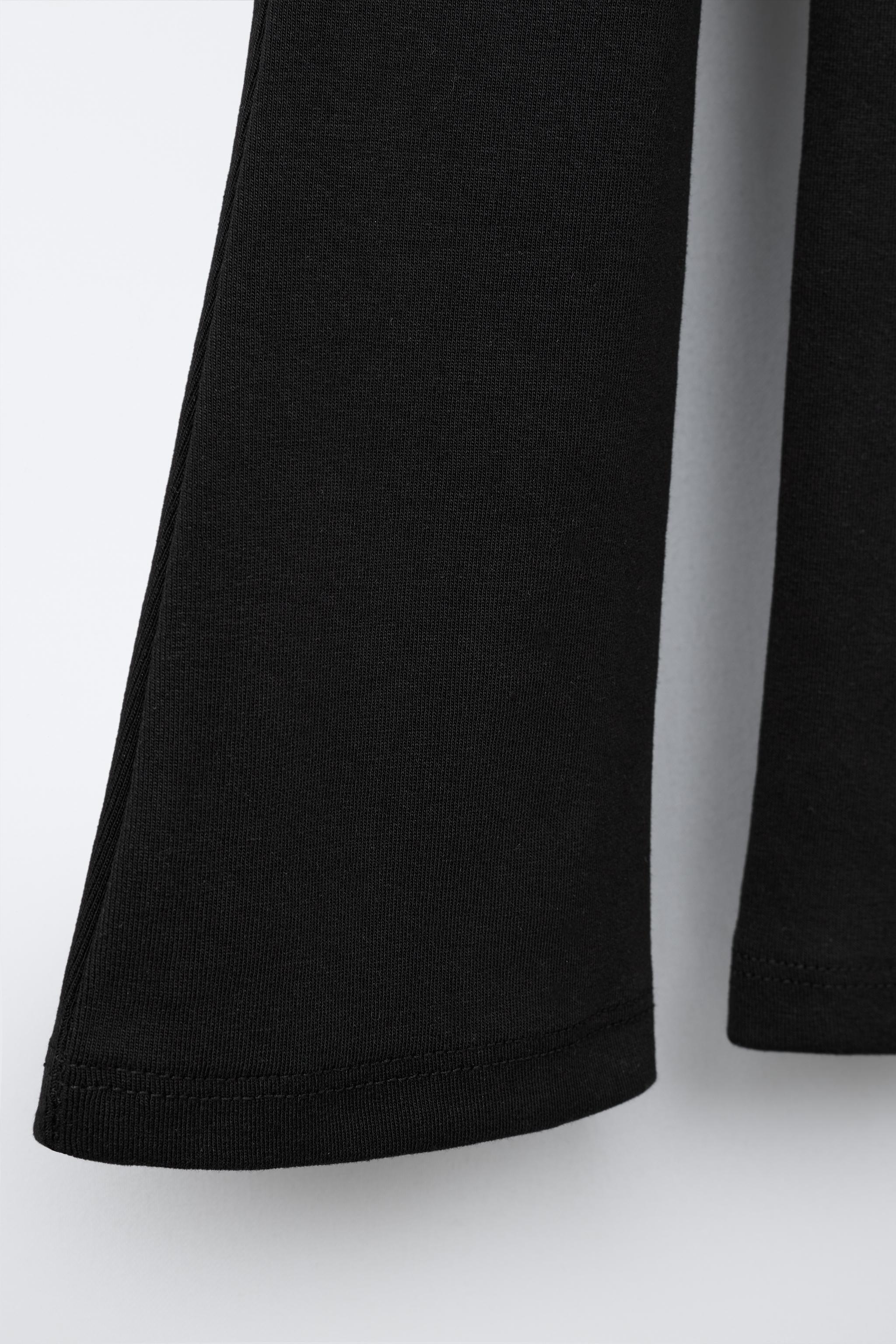 LABEL DETAIL INTERLOCK FLARE LEGGINGS